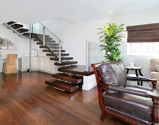 Design ideas for a large contemporary wood u-shaped staircase in Albuquerque with open risers.