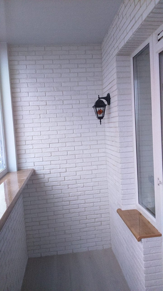 Замена остекления, утепление и отделка балкона декоративным камнем