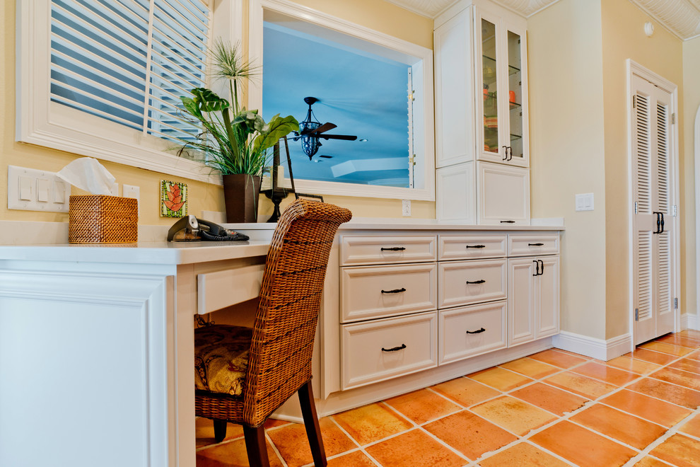 Inspiration for a large transitional u-shaped terra-cotta tile and orange floor eat-in kitchen remodel with an undermount sink, recessed-panel cabinets, white cabinets, quartz countertops, white backsplash, subway tile backsplash, stainless steel appliances and an island