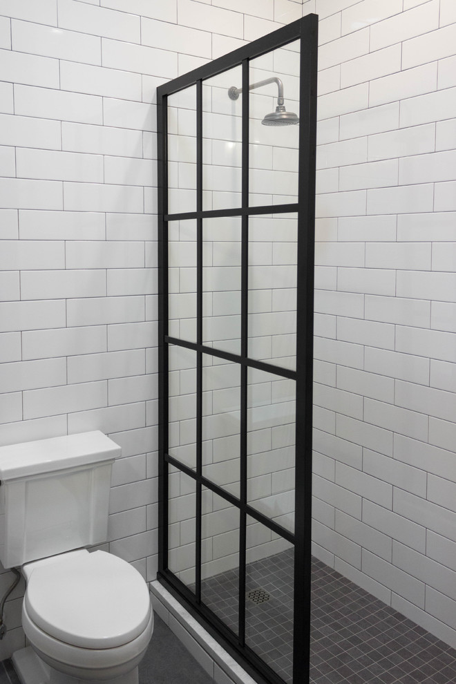 This is an example of a country bathroom in Tampa with white tile, subway tile, white walls, porcelain floors and grey floor.