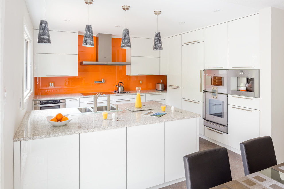 Design ideas for a mid-sized modern eat-in kitchen in Toronto with a double-bowl sink, flat-panel cabinets, white cabinets, quartz benchtops, orange splashback, glass sheet splashback, stainless steel appliances, cork floors and a peninsula.