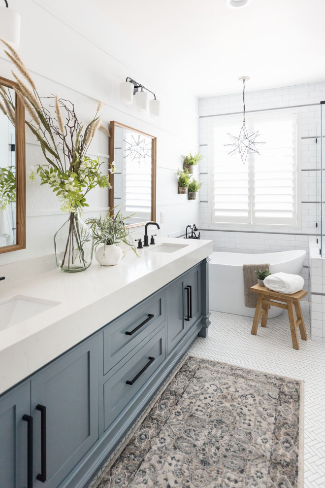 Transitional master white floor and double-sink freestanding bathtub photo in Phoenix with shaker cabinets, blue cabinets, quartz countertops and a freestanding vanity