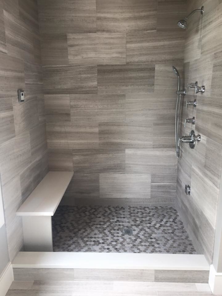 Photo of a mid-sized modern master bathroom in Boston with a freestanding tub, an alcove shower, gray tile, mosaic tile, grey walls and marble floors.