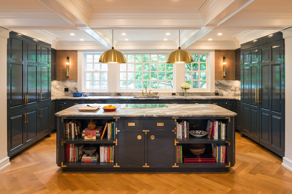 Design ideas for a large traditional u-shaped eat-in kitchen in Minneapolis with a single-bowl sink, raised-panel cabinets, blue cabinets, marble benchtops, white splashback, marble splashback, panelled appliances, light hardwood floors and with island.