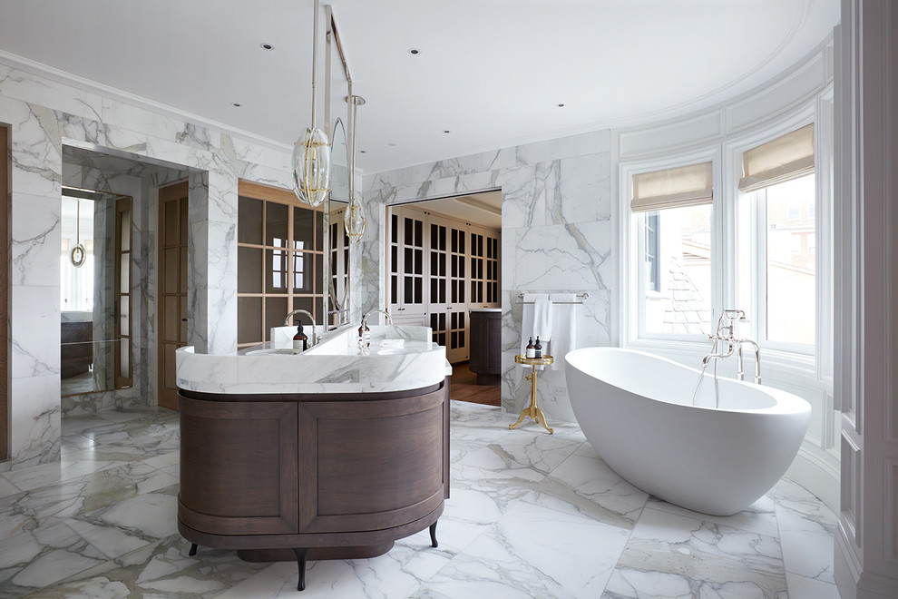 Photo of a transitional master bathroom in San Francisco with dark wood cabinets, a freestanding tub, shaker cabinets, multi-coloured tile, marble, multi-coloured walls, marble floors, marble benchtops, multi-coloured floor, multi-coloured benchtops, a double vanity and a freestanding vanity.