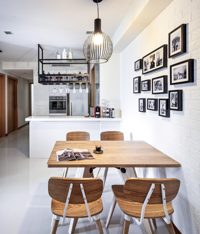 This is an example of a scandinavian kitchen/dining combo in Singapore with white walls.