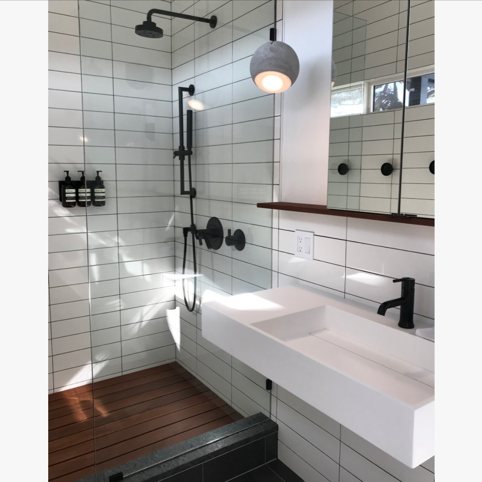 Design ideas for a contemporary master bathroom in New York with a freestanding tub, an open shower, a one-piece toilet, white tile, porcelain tile, white walls, marble floors, an undermount sink, engineered quartz benchtops, white floor, an open shower, grey benchtops, a double vanity and a floating vanity.