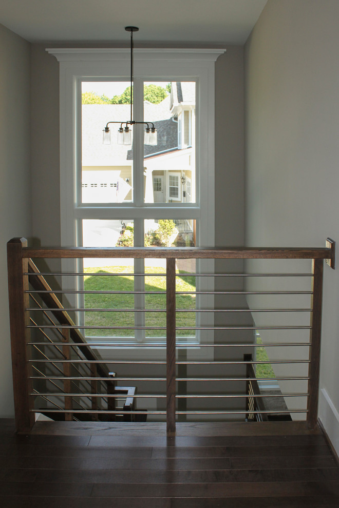 Inspiration for a large contemporary wood u-shaped staircase in DC Metro with mixed railing.