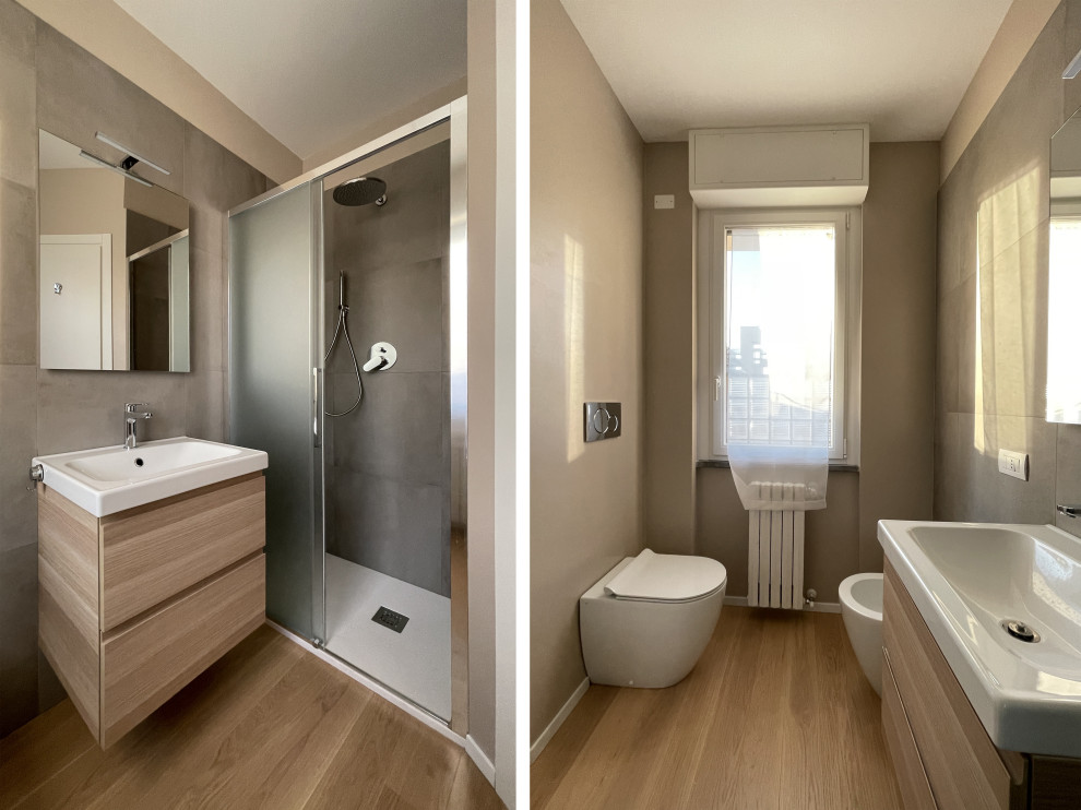 Small modern bathroom in Milan with flat-panel cabinets, brown cabinets, a two-piece toilet, brown tile, ceramic tile, brown walls, medium hardwood floors, an integrated sink, brown floor, white benchtops, a floating vanity and recessed.
