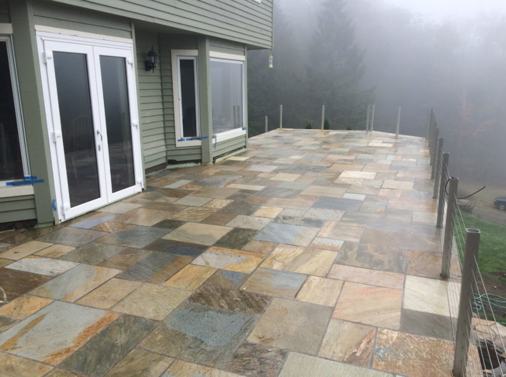Inspiration for a large modern backyard deck remodel in Seattle with no cover