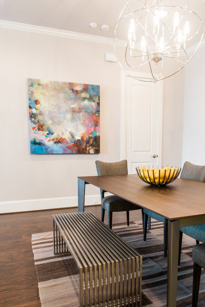 Mid-sized transitional medium tone wood floor kitchen/dining room combo photo in Austin with beige walls and no fireplace