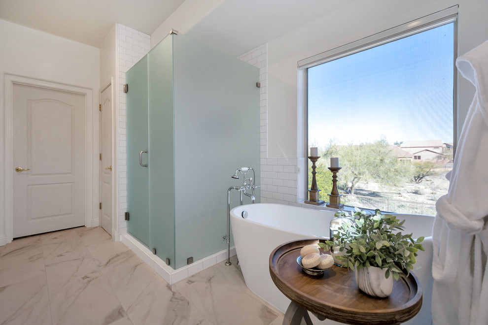 Freestanding bathtub - mid-sized transitional master white tile and subway tile porcelain tile and white floor freestanding bathtub idea in Phoenix with a hinged shower door