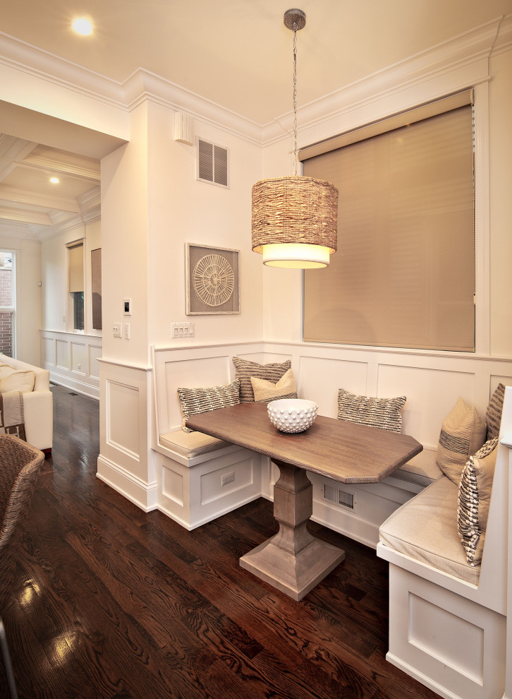 Inspiration pour une petite salle à manger design avec une banquette d'angle, un mur blanc, parquet foncé et un sol marron.