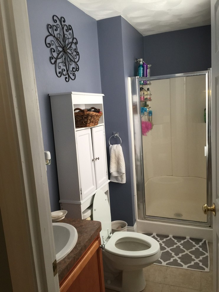 This is an example of a small traditional 3/4 bathroom in Providence with purple walls and porcelain floors.