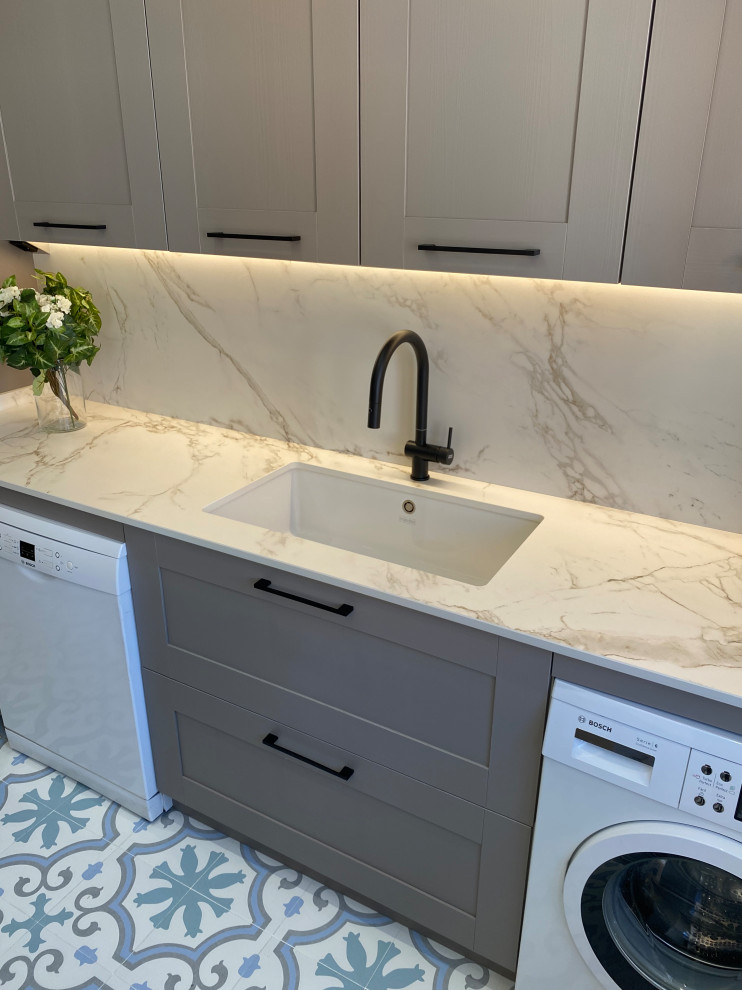 Large transitional u-shaped porcelain tile and multicolored floor enclosed kitchen photo in Other with an undermount sink, beaded inset cabinets, pink cabinets, marble countertops, white backsplash, marble backsplash, colored appliances, two islands and white countertops