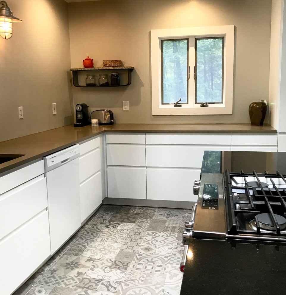 Mid-sized contemporary l-shaped separate kitchen in New York with an undermount sink, flat-panel cabinets, white cabinets, quartzite benchtops, white appliances, ceramic floors, with island and grey floor.