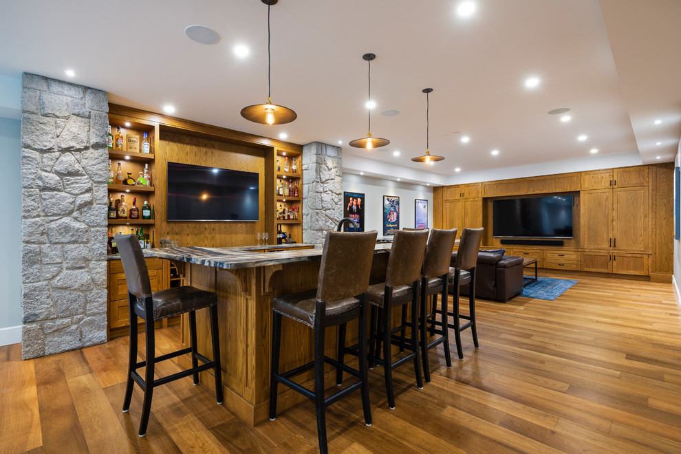 Photo of a transitional u-shaped seated home bar in Vancouver with shaker cabinets, medium wood cabinets, timber splashback and medium hardwood floors.