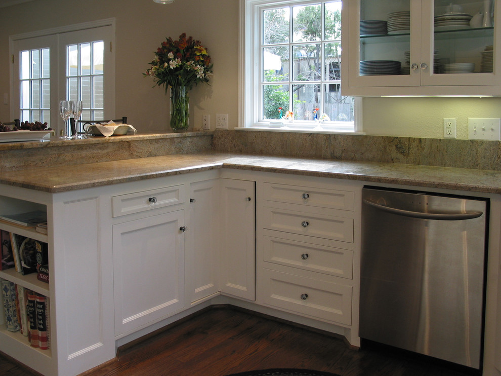 Inspiration for a small traditional u-shaped eat-in kitchen in Dallas with an undermount sink, beaded inset cabinets, white cabinets, granite benchtops, beige splashback, stainless steel appliances, dark hardwood floors, no island, granite splashback, brown floor and beige benchtop.