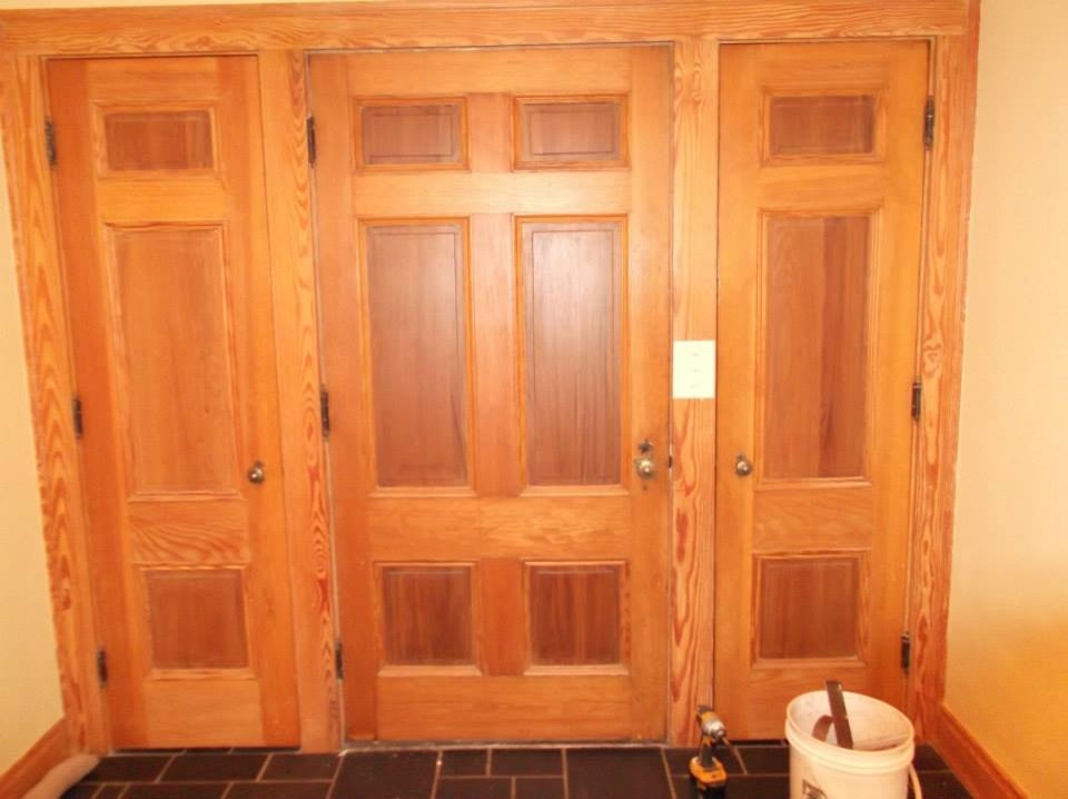 Transitional ceramic tile front door photo in Cleveland with yellow walls and a medium wood front door