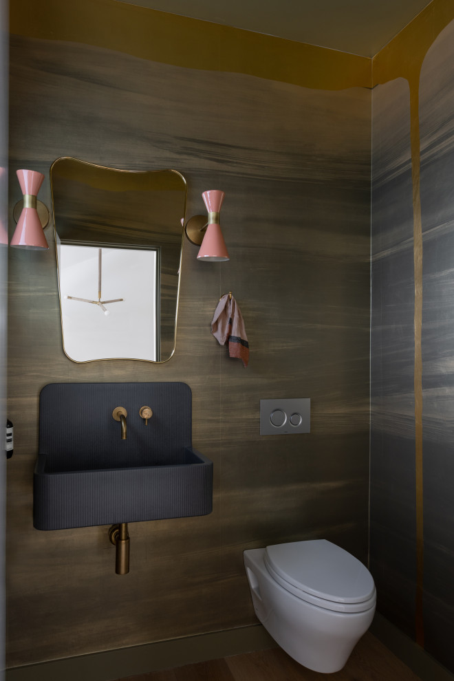 This is an example of a contemporary powder room in San Francisco with a wall-mount toilet, multi-coloured walls, a wall-mount sink and wallpaper.