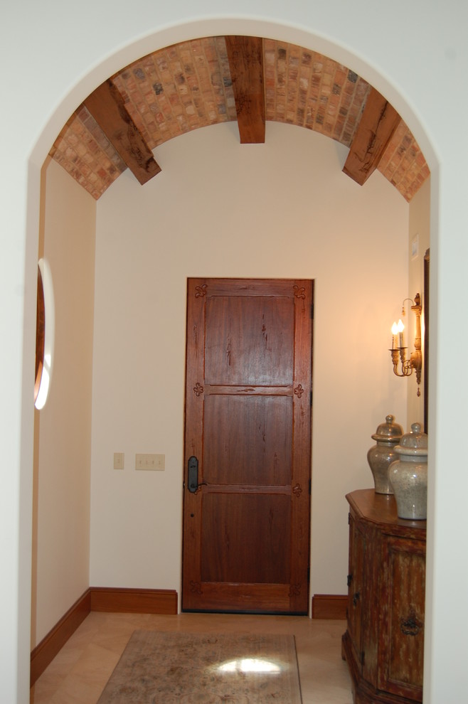 Front door - mid-sized rustic ceramic tile front door idea in Miami with white walls and a dark wood front door
