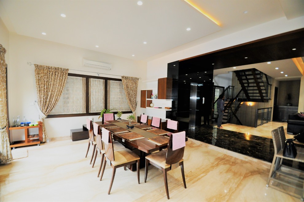 This is an example of a contemporary dining room in Bengaluru.