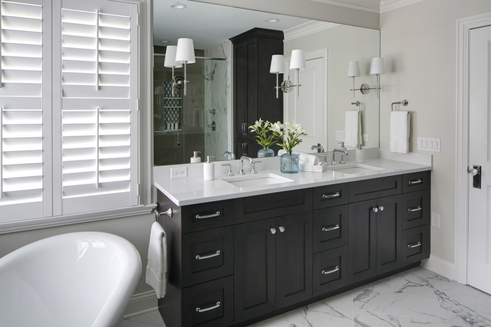 Example of a mid-sized master porcelain tile, white floor and double-sink freestanding bathtub design in Chicago with shaker cabinets, dark wood cabinets, an undermount sink, quartz countertops, white countertops and a freestanding vanity