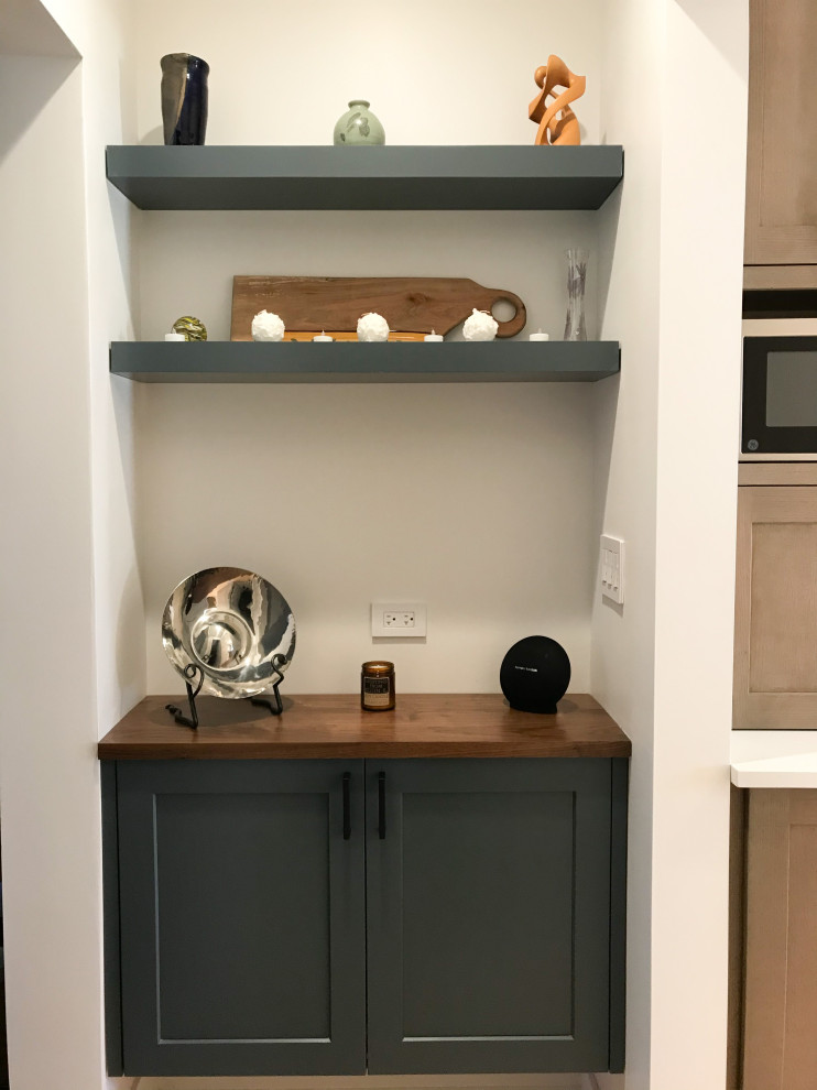 Example of a large transitional l-shaped eat-in kitchen design in Chicago with a double-bowl sink, shaker cabinets, white cabinets, quartz countertops, multicolored backsplash, porcelain backsplash, stainless steel appliances, an island and white countertops