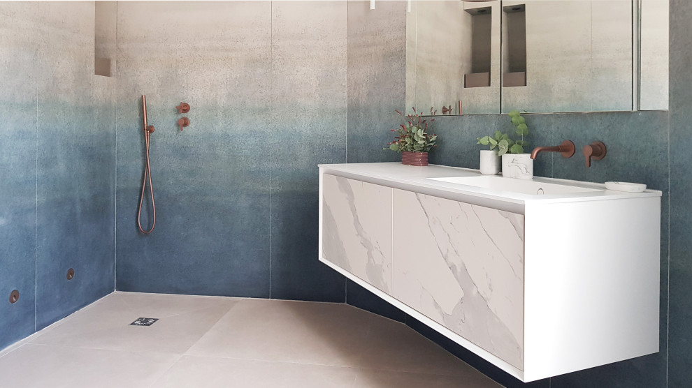 Inspiration for a large master bathroom in Paris with an undermount tub, a curbless shower, blue tile, ceramic tile, blue walls, ceramic floors, a console sink, marble benchtops, beige floor, an open shower and white benchtops.