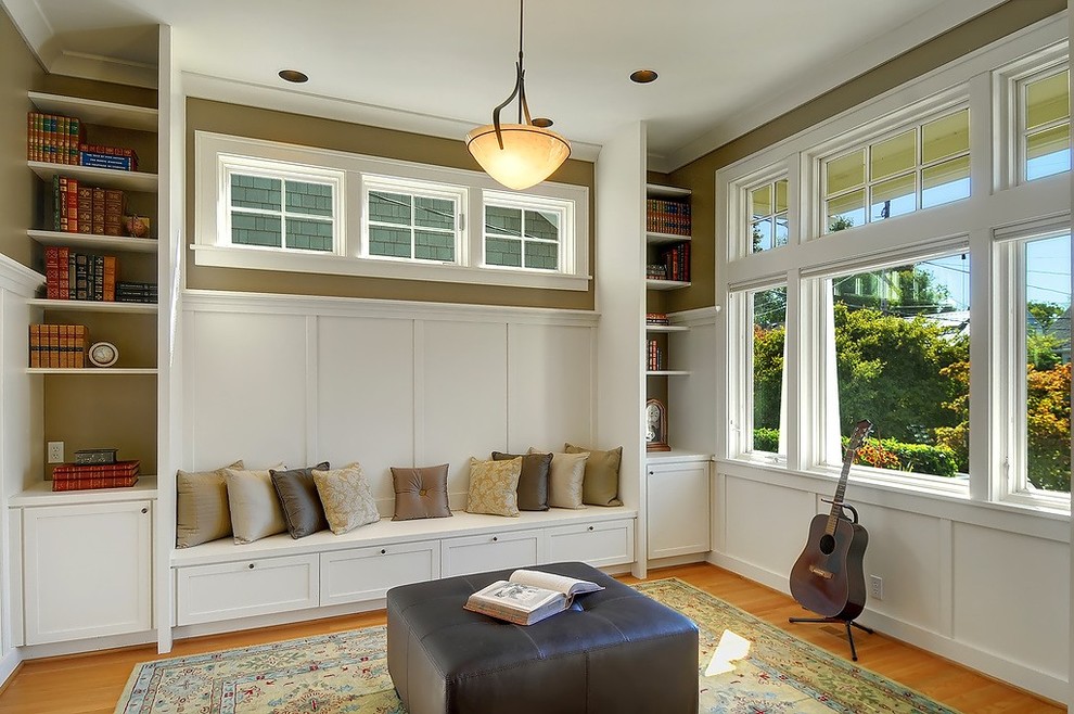 Design ideas for an arts and crafts enclosed family room in Seattle with a music area, beige walls and medium hardwood floors.
