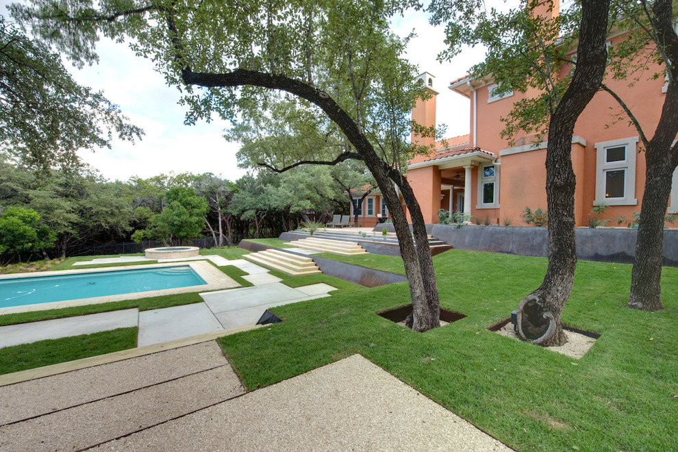 Photo of a contemporary garden in Austin with a retaining wall.