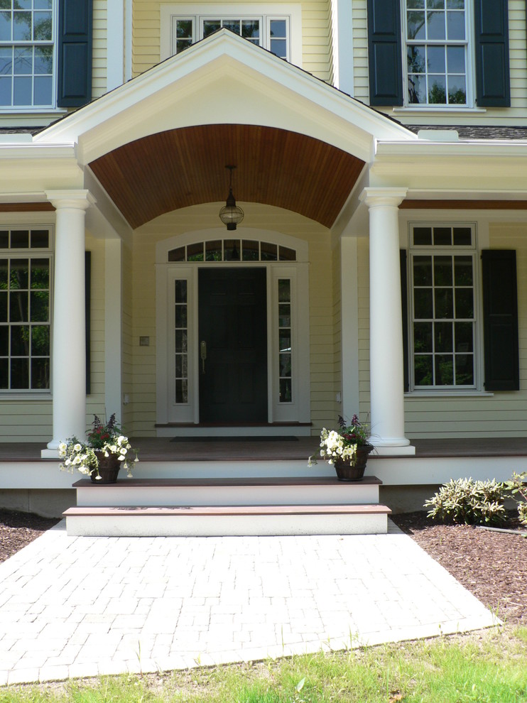 Inspiration for a transitional entryway in New York with a single front door and a dark wood front door.