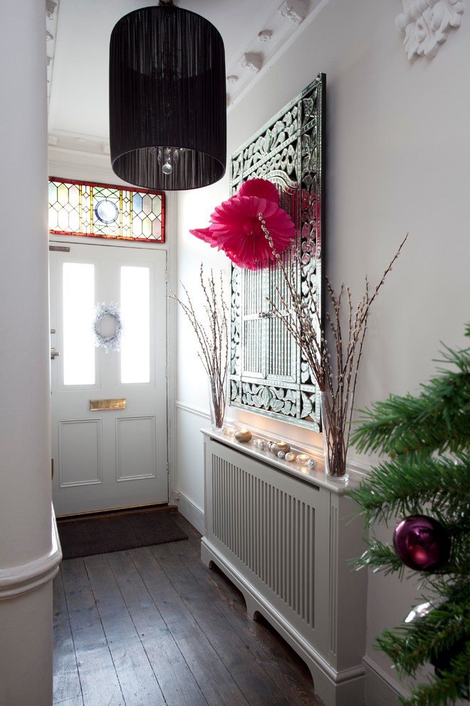 Design ideas for a transitional entryway in London.