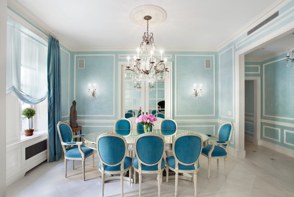 Mid-sized separate dining room in New York with blue walls, limestone floors and no fireplace.
