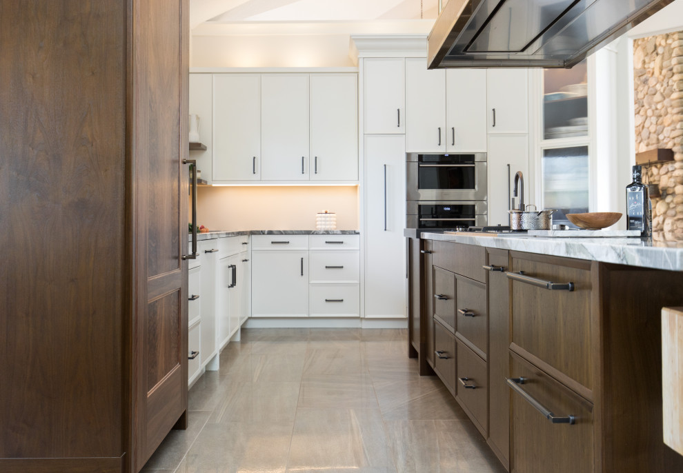 Example of a transitional kitchen design in Calgary