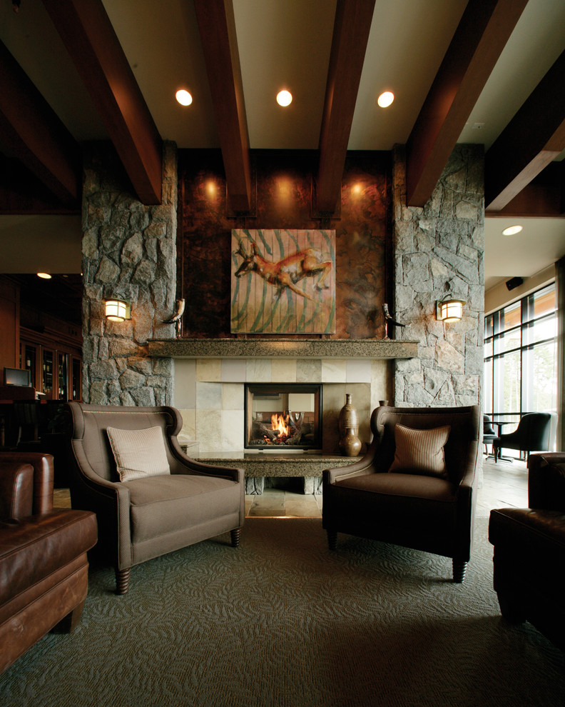 Photo of a traditional living room in Denver with multi-coloured walls, carpet, a two-sided fireplace and a tile fireplace surround.
