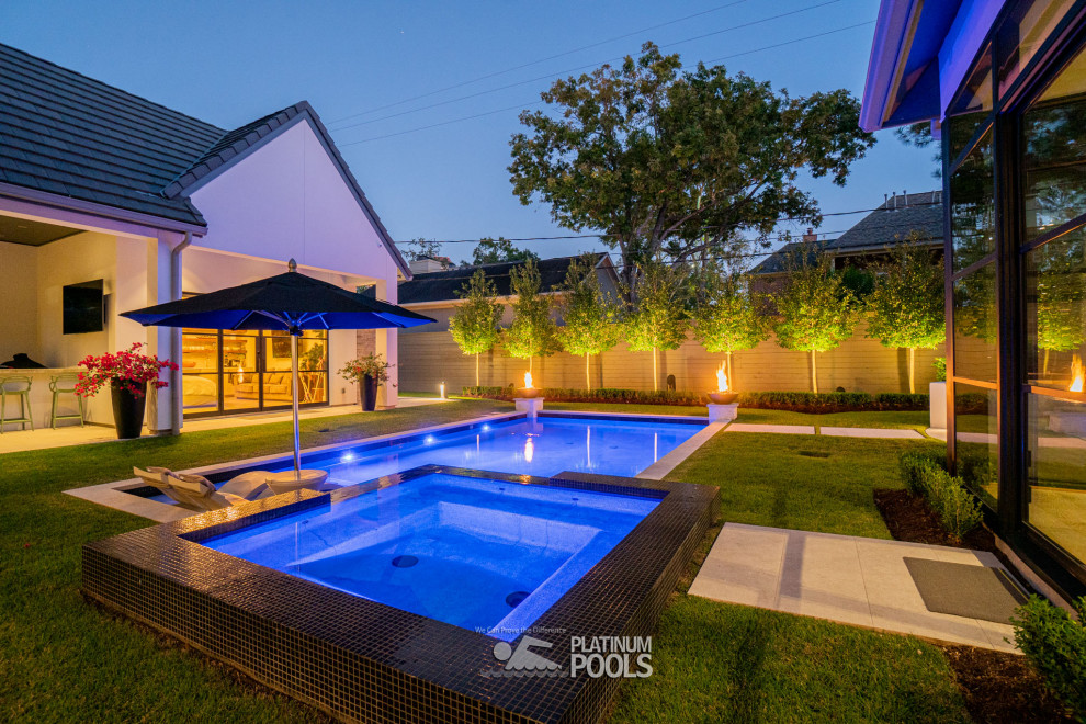 This is an example of a small contemporary backyard rectangular pool in Houston.