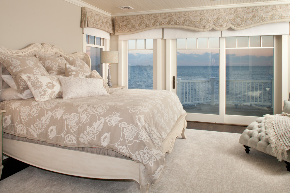 Inspiration for a beach style master bedroom in New York with grey walls and dark hardwood floors.