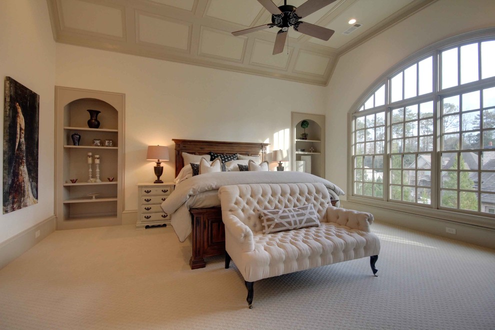 Mid-sized transitional master bedroom in Atlanta with beige walls and carpet.