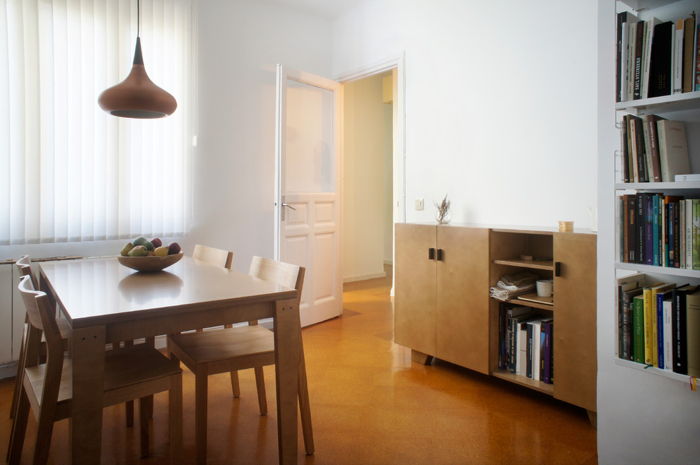 Design ideas for a small scandinavian separate dining room in Madrid with white walls and no fireplace.