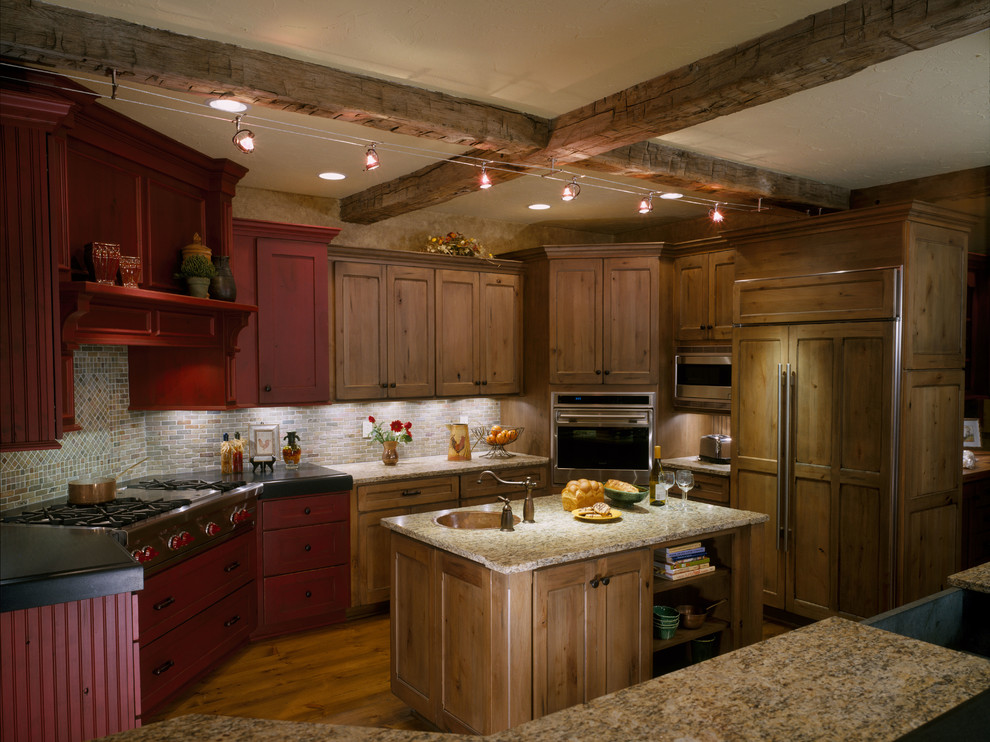 Inspiration for a mid-sized country u-shaped open plan kitchen in Cleveland with a single-bowl sink, recessed-panel cabinets, red cabinets, multi-coloured splashback, stainless steel appliances, slate splashback, granite benchtops, medium hardwood floors, brown floor, multiple islands, beige benchtop and exposed beam.