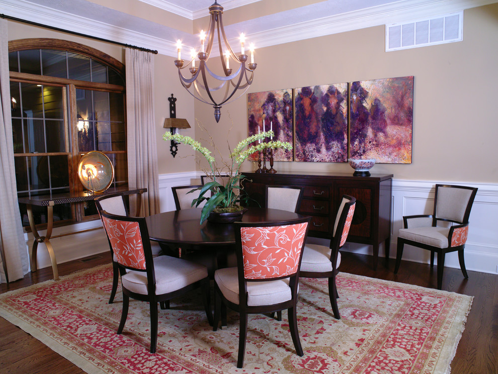 This is an example of a mid-sized traditional separate dining room in Atlanta with beige walls, medium hardwood floors and no fireplace.