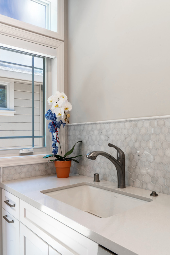 Inspiration for a small transitional galley porcelain tile and gray floor enclosed kitchen remodel in San Francisco with an undermount sink, shaker cabinets, white cabinets, quartz countertops, gray backsplash, mosaic tile backsplash, stainless steel appliances and yellow countertops