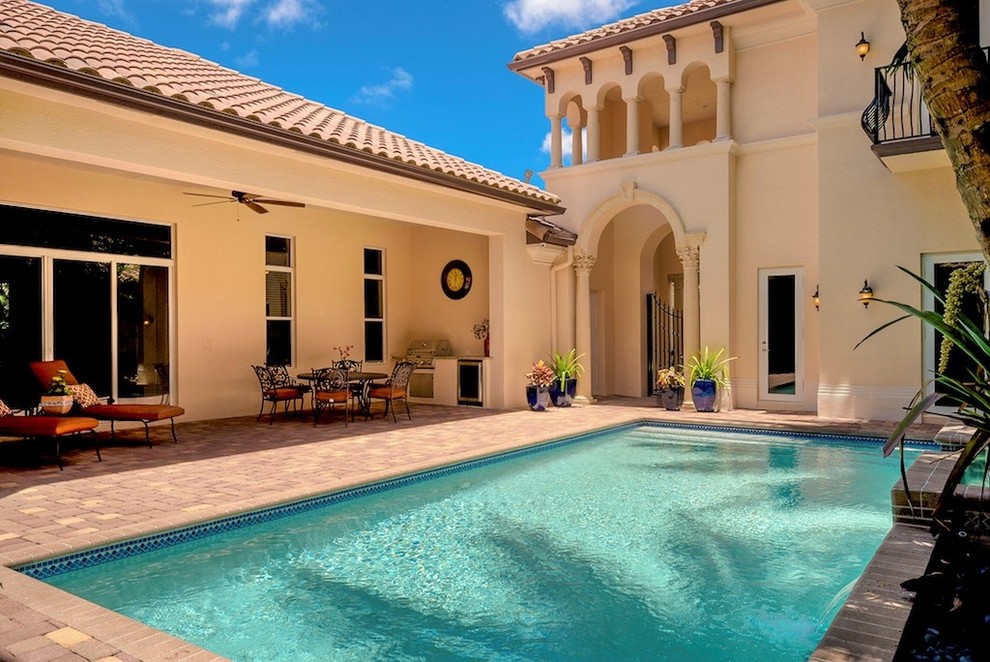 Design ideas for a large mediterranean courtyard pool in Miami.