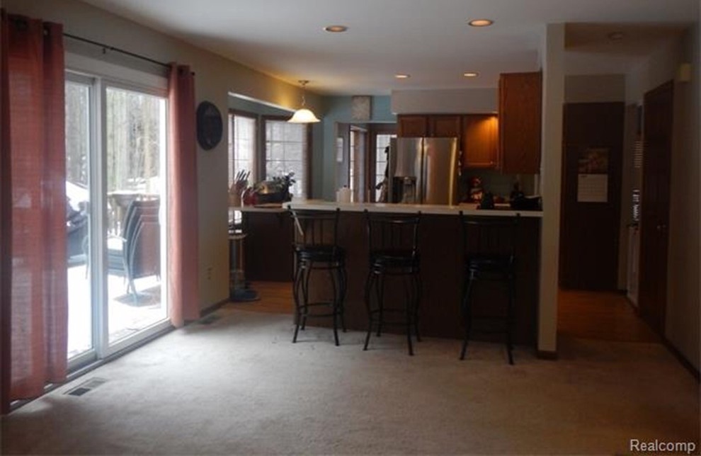 Electric range anchored in front of a bay window!