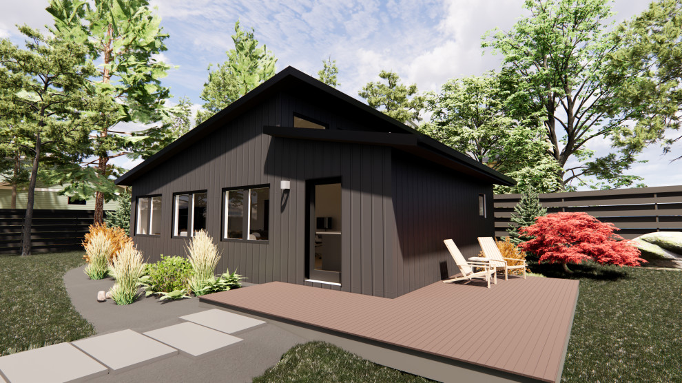 Photo of a medium sized and black contemporary bungalow tiny house in Portland with concrete fibreboard cladding, a lean-to roof, a shingle roof, a black roof and board and batten cladding.