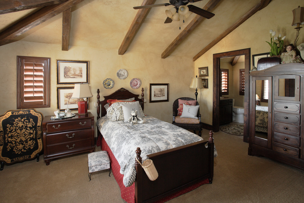 This is an example of a traditional bedroom in Other with beige walls and carpet.