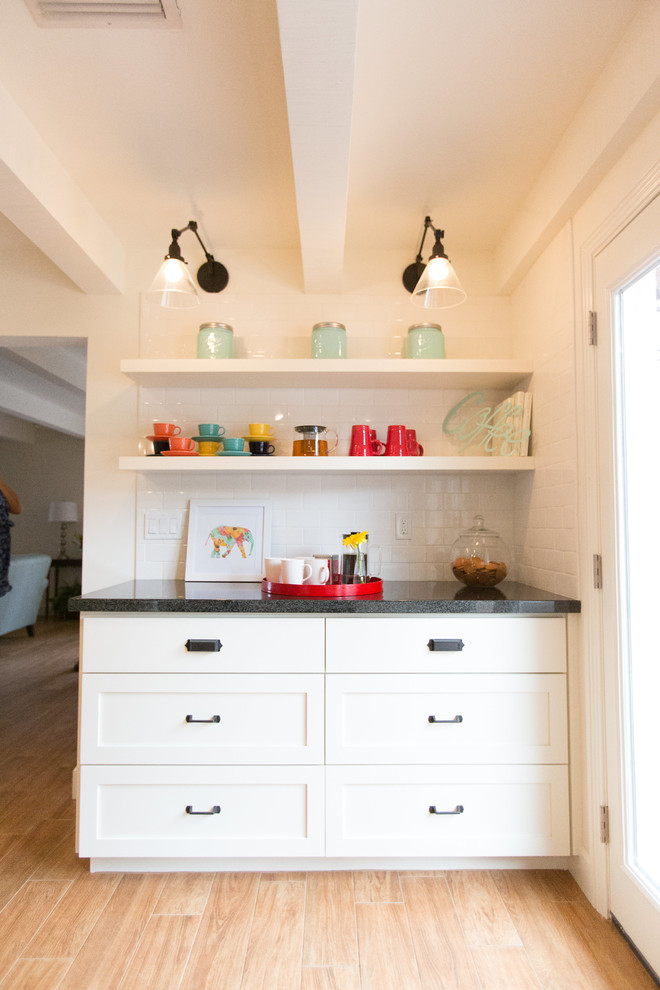 Inspiration for a mid-sized craftsman u-shaped ceramic tile and brown floor kitchen pantry remodel in Phoenix with a double-bowl sink, shaker cabinets, white cabinets, wood countertops, white backsplash, subway tile backsplash, stainless steel appliances and an island