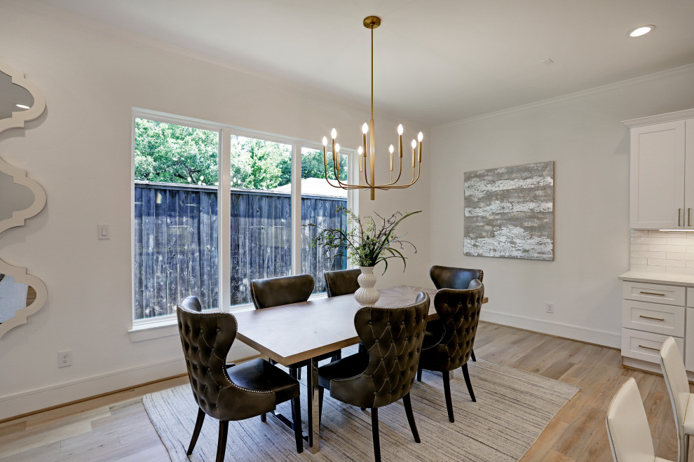 Photo of a transitional dining room in Houston.