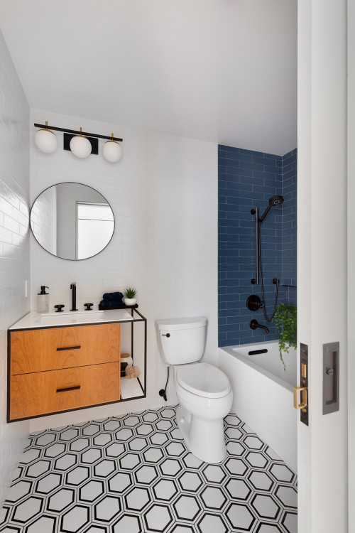 Modern bathroom cabinets for small bathrooms with floating wood vanity, geometric tile floor, and compact bathtub design